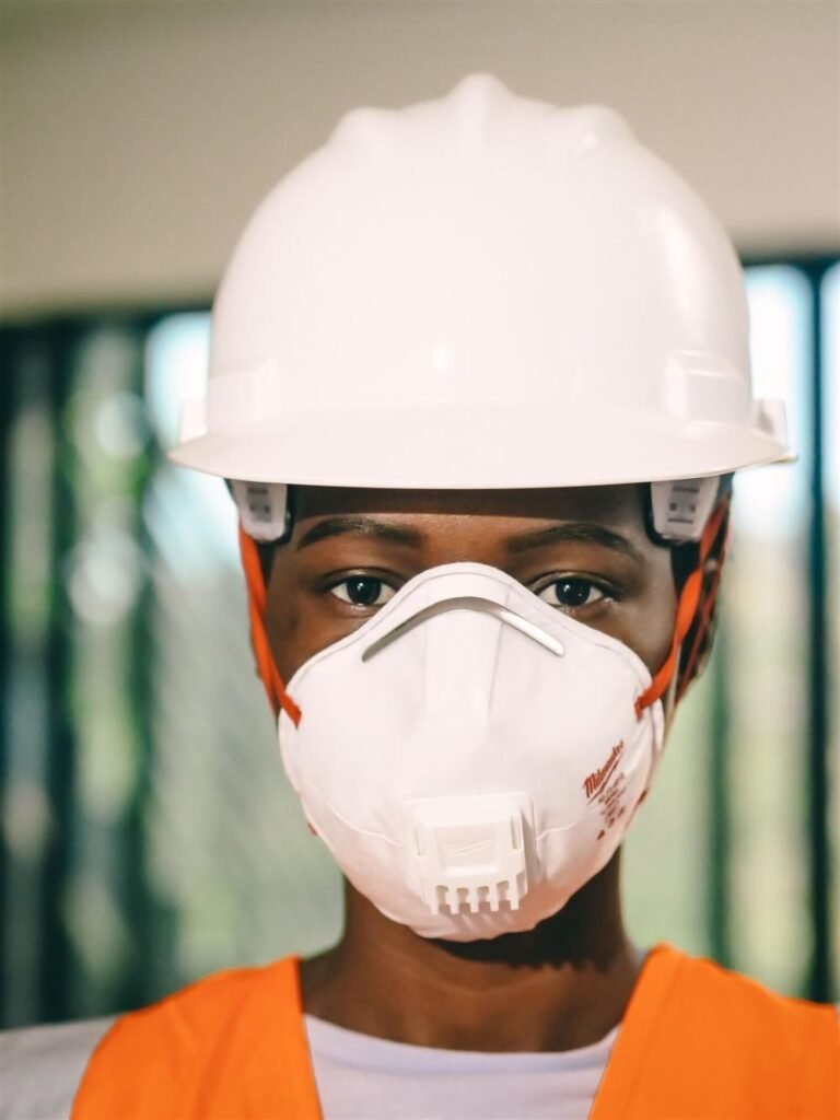 About 3 Mold remediation worker wearing a respirator in Cary NC
