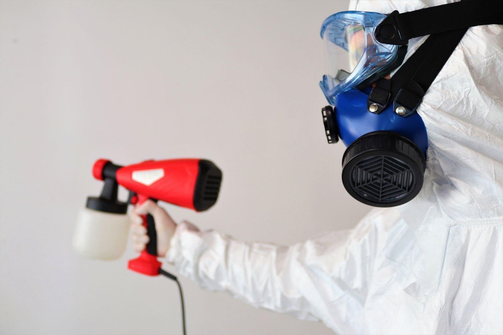 About 1 Mold removal technician spraying antimicrobial treatment in a Cary NC home