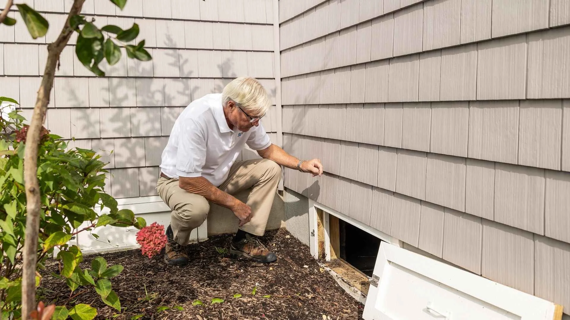 Crawl Space Mold Removal Cary NC 1 Crawl space mold removal in Cary NC: inspector checking a crawl space
